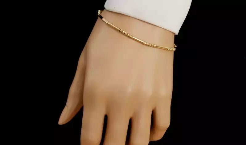 Elegantný zlatý náramok s guľôčkami a trubičkami